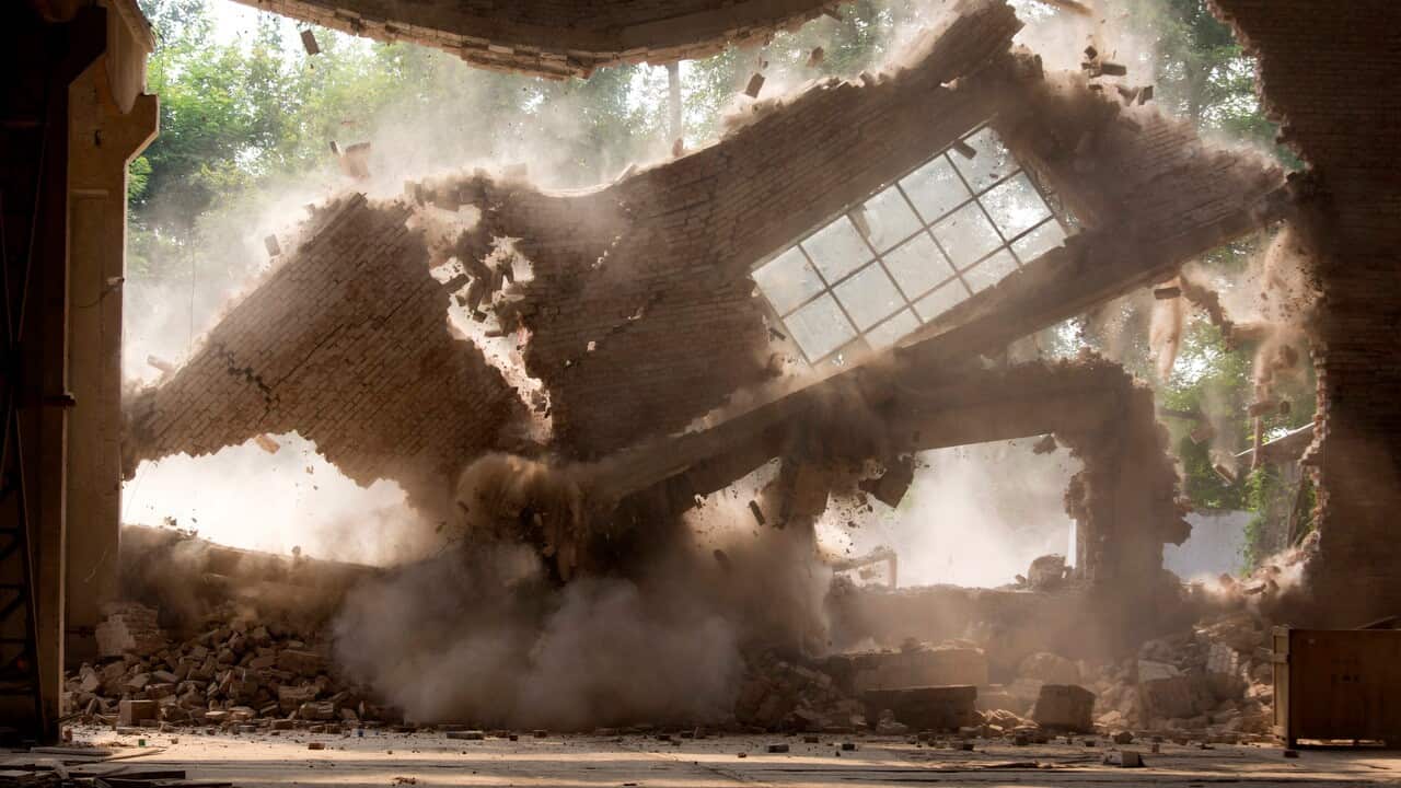 Walls of Chinese artist Ai Weiwei's studio collapse during demolition in Beijing.