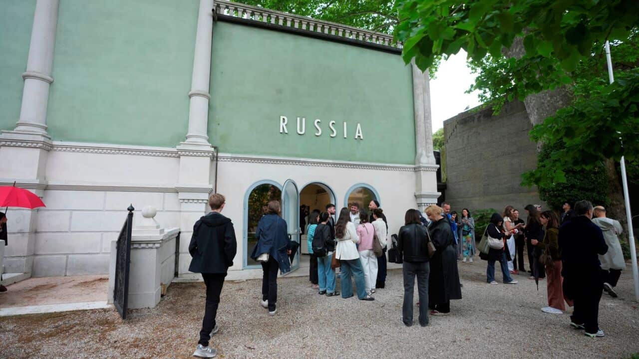 Visitors stand outside the Russia pavilion at the Venice 2026 Biennale Art, Italy, Tuesday, May 5, 2026. (AP Photo-Luca Bruno).jpg