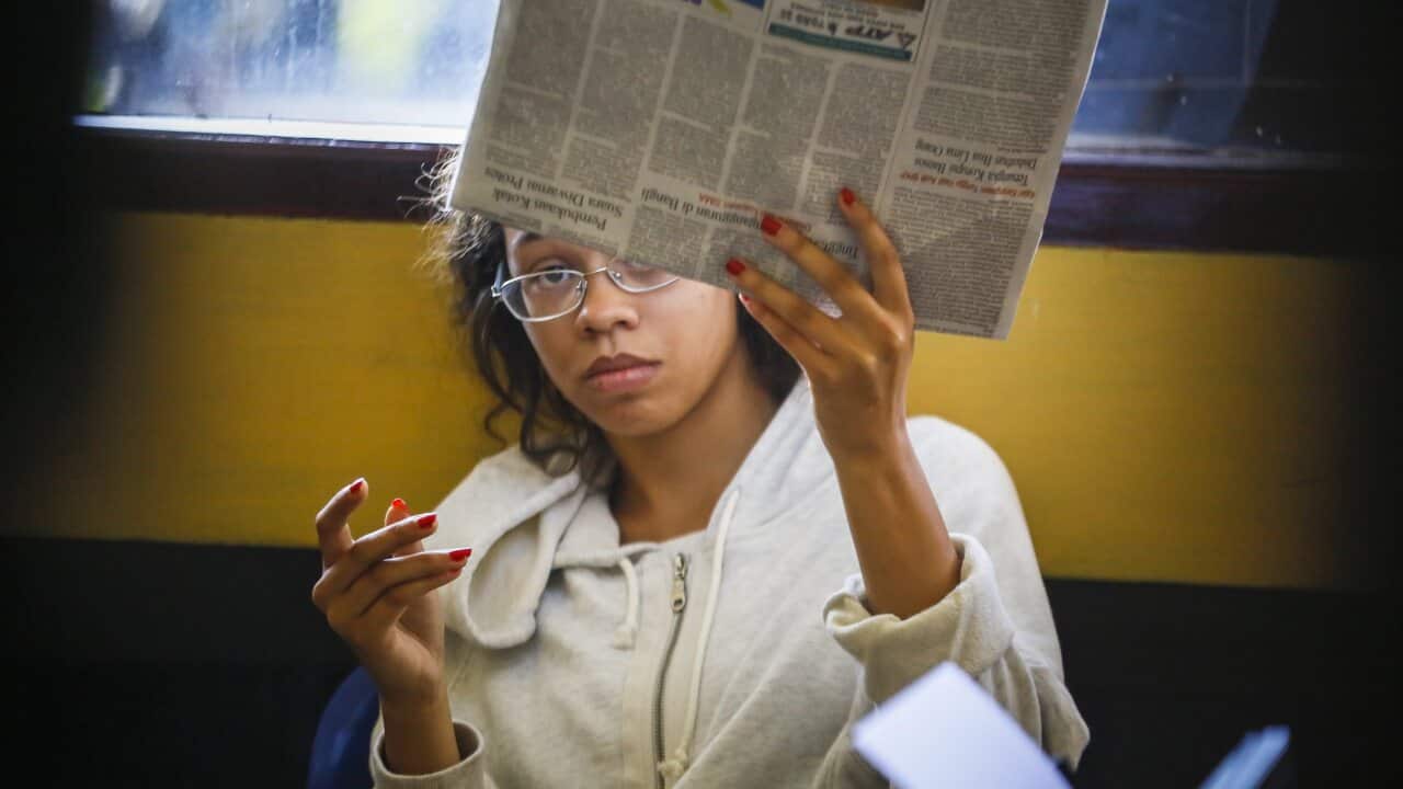 US woman Heather Louis Mack is questioned by police