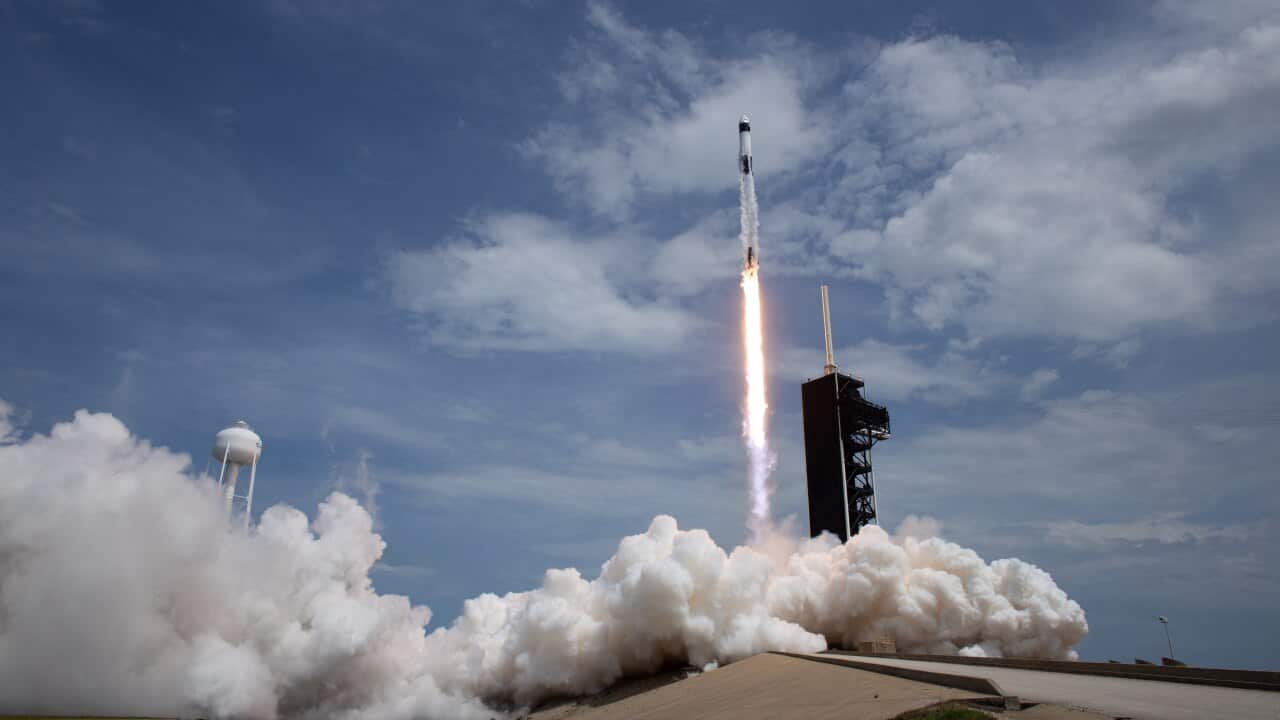 SpaceX Falcon 9 rocket carrying the company's Crew Dragon spacecraft is launched from Launch Complex 39A.