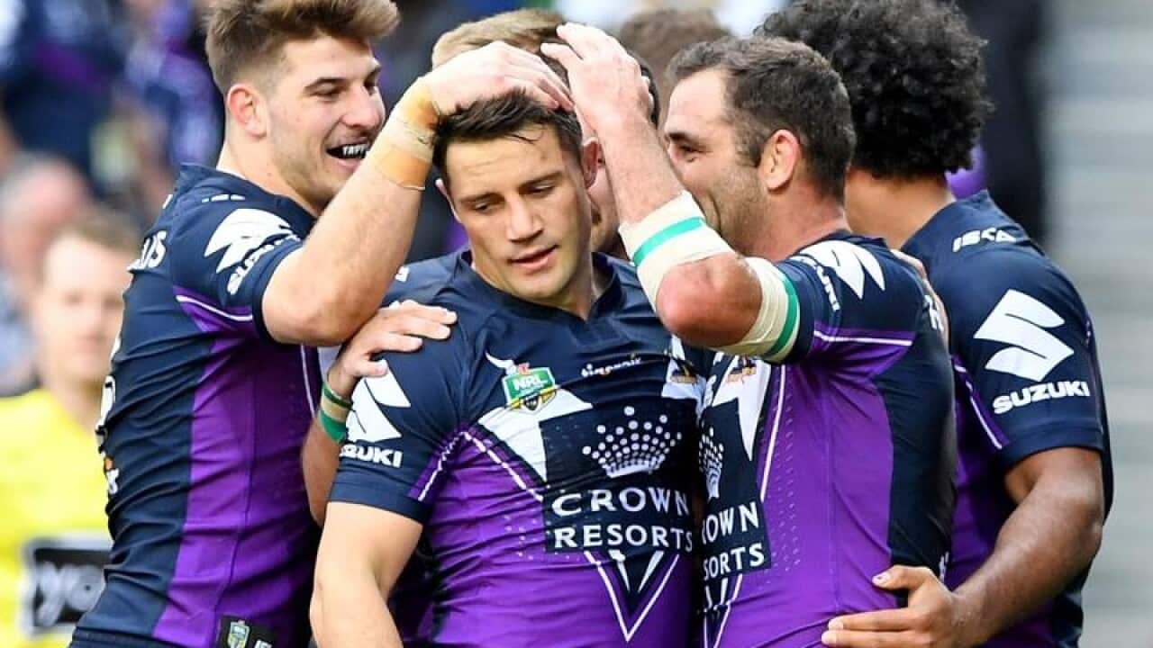 Teammates congratulate Cooper Cronk