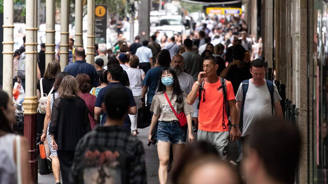 People seen wearing face masks on Pitt Street, Sydney, Friday, 18 December, 2020.
