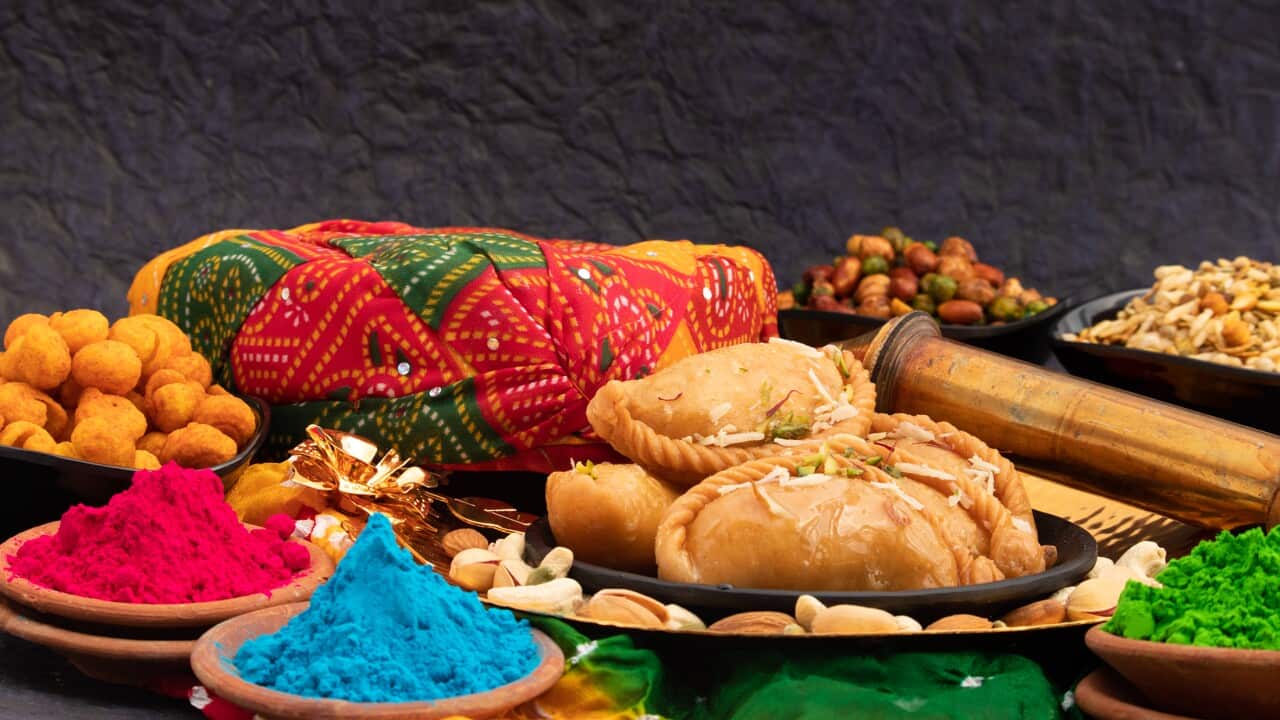 Indian Mithai Gujia Also Called Gujiya, Pirukiya, Pirukia, Pedakiya, Karanji, Basundi Gughra Made Of Suji Ghee Stuffed With Mawa Khoya Chasni Mava And Khoa With Holi Pagadi, Safa Pichkari Gulal Abeer