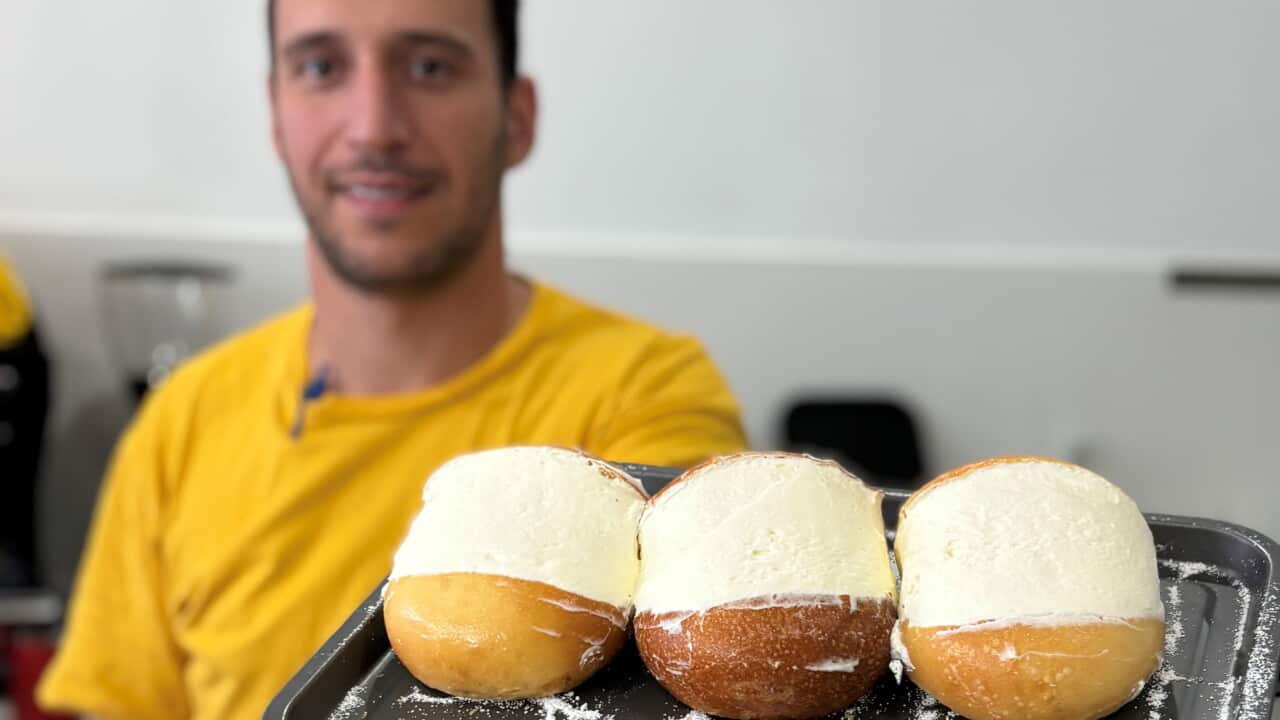 Marco Andruccioli with a tray of maritozzi in Corso Francia.