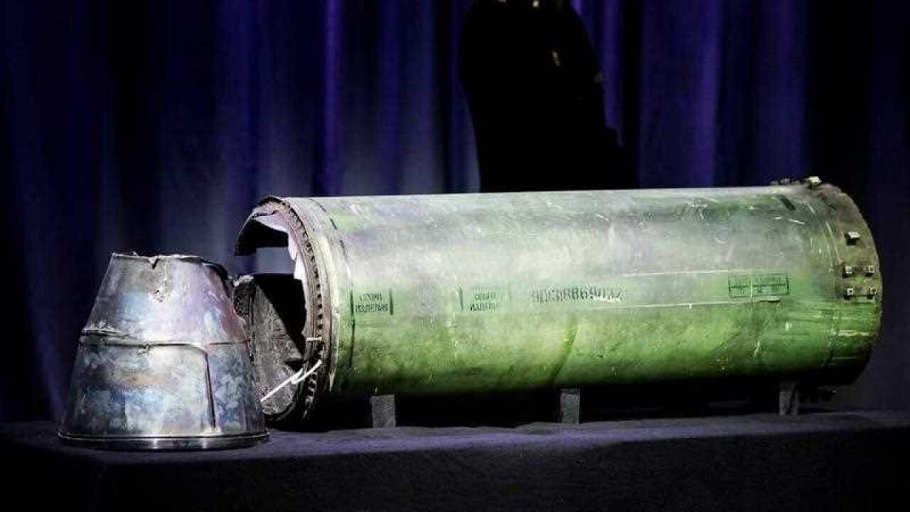 A damaged Buk missile that was reportedly fired on the MH17 is displayed during a press conference of the Joint Investigation Team (JIT) on the ongoing investigation of the Malaysia Airlines MH17 crash in 2014, in Bunnik, The Netherlands, 24 May 2018.