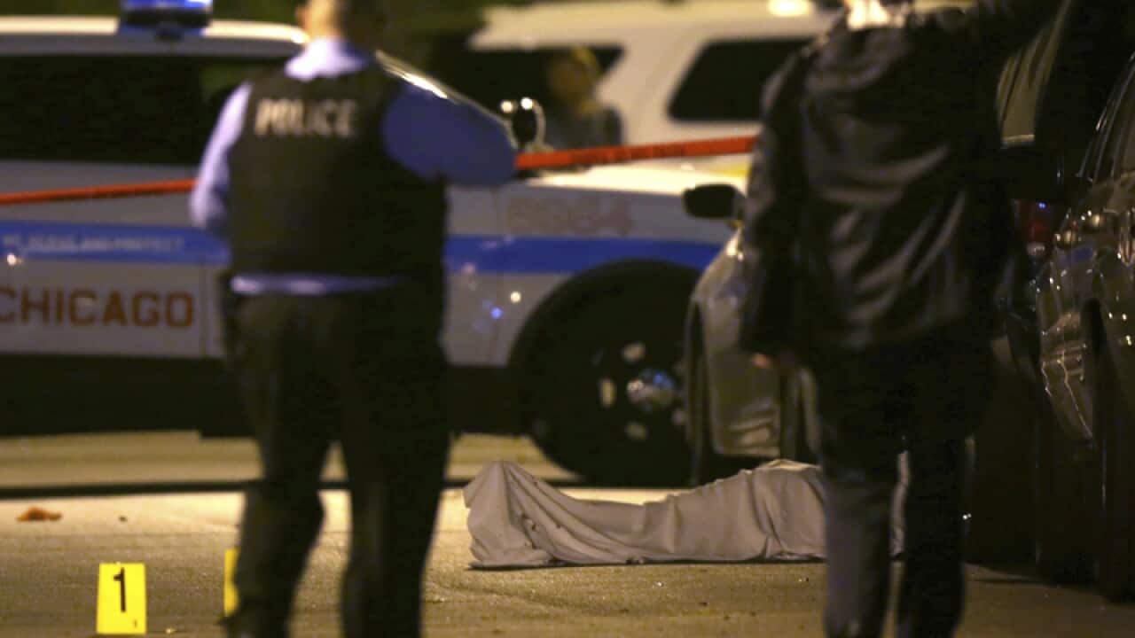 Police at the scene of a fatal shooting in Chicago
