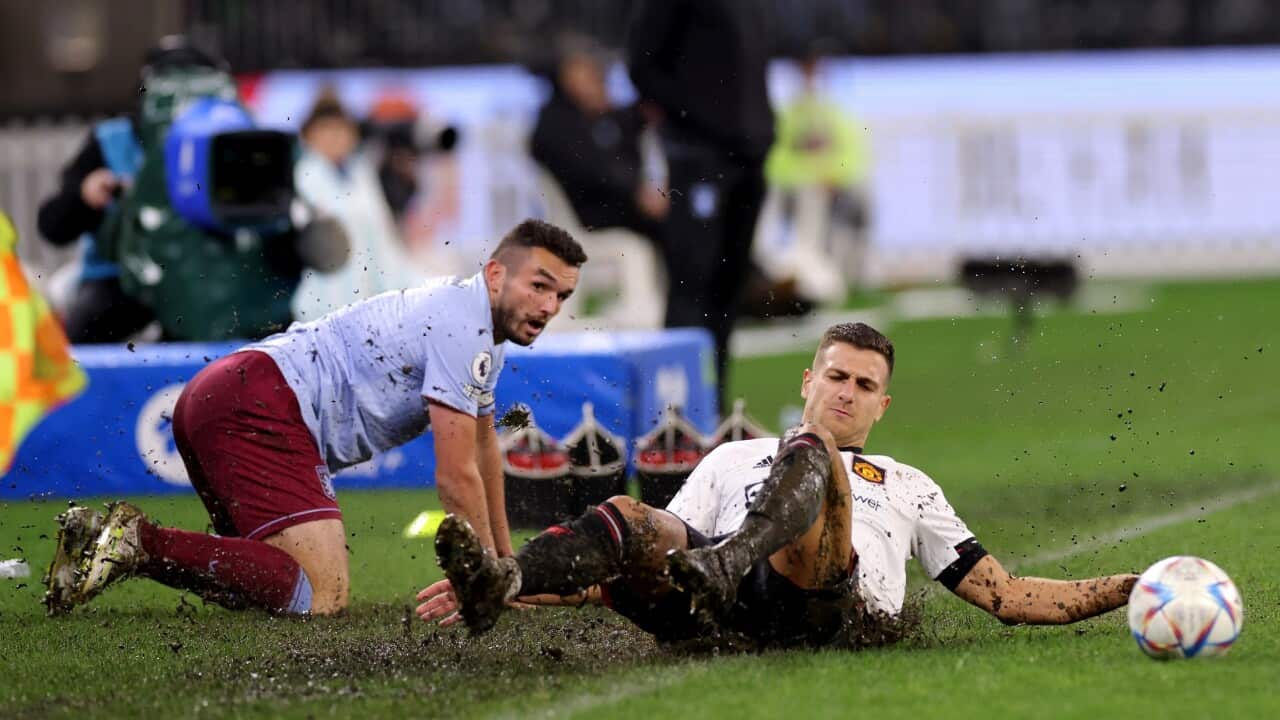 Diogo Dalot of Manchester United is tackled by John McGinn of Aston Villa during the soccer match