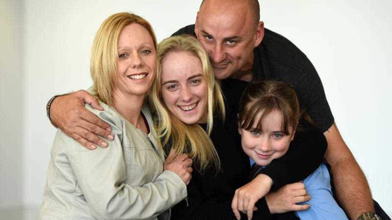 Alyssa Azar (centre), her mother Therese, father Glenn and sister Samantha, 8, pose for a photo after Alyssa'a arrival in Toowoomba, west of Brisbane, Tuesday, June 7, 2016. Ms Azar, 19, recently became the youngest Australian to climb Mount Everest. (AAP