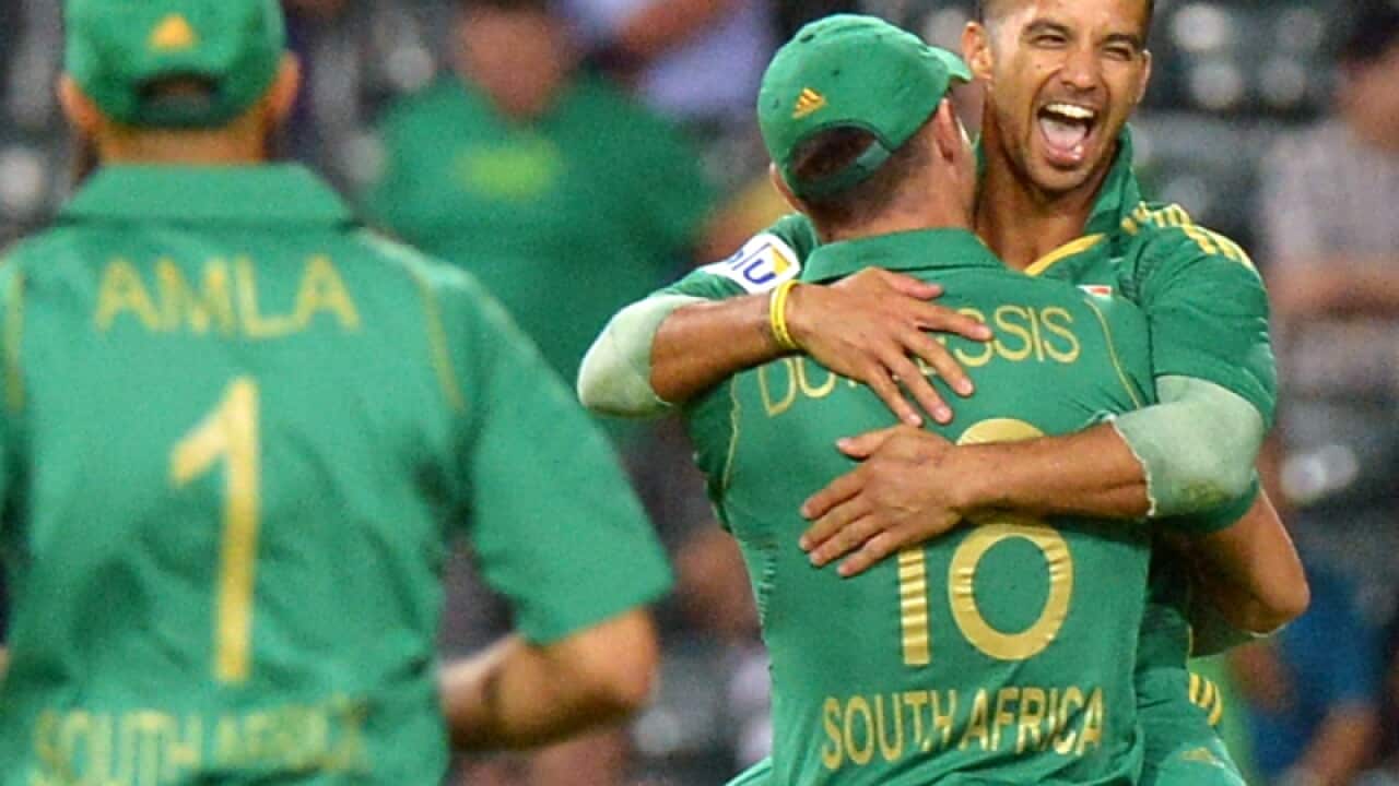 South Africa's Jean-Paul Duminy (R) celebrates after taking a wicket