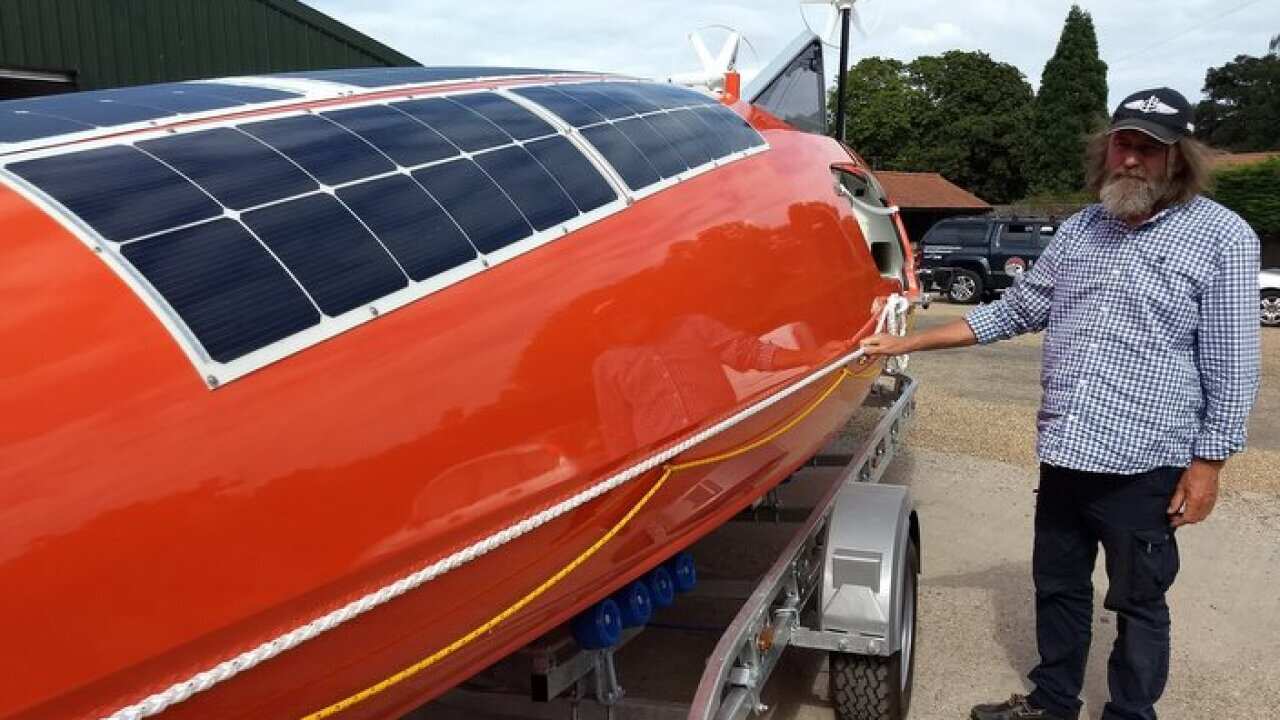 Fedor Konyukhov next to Akros boat