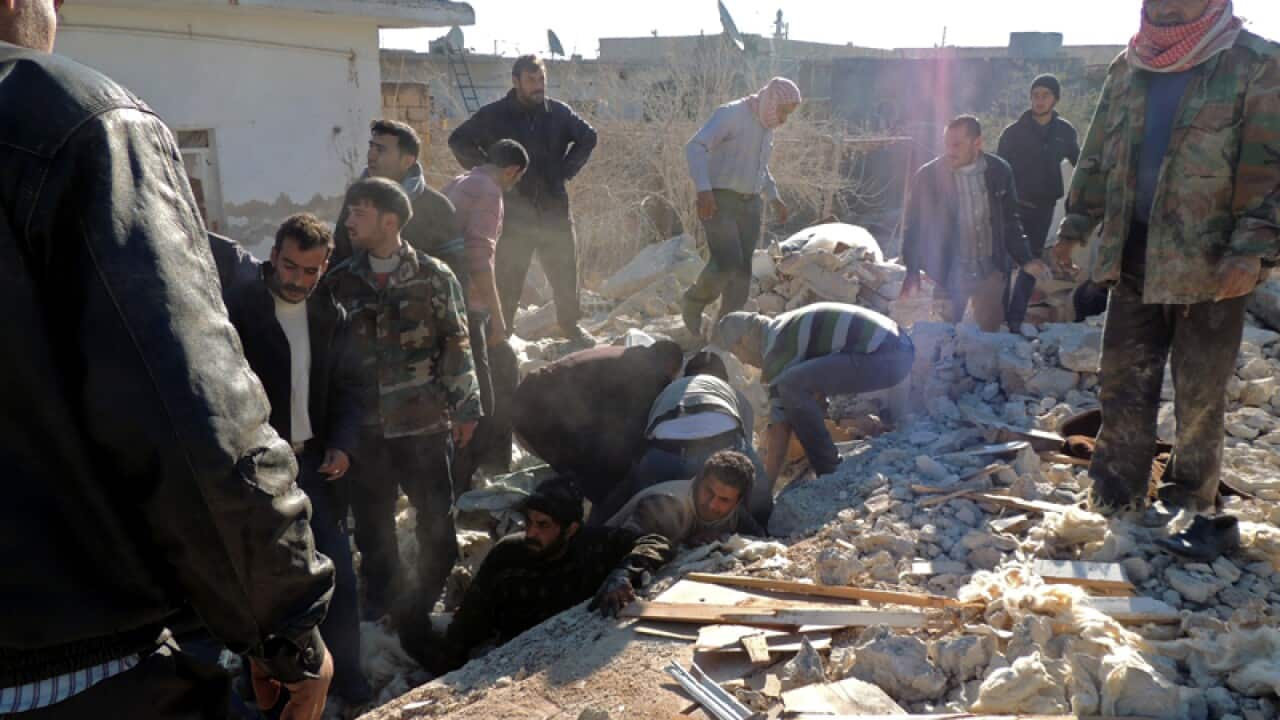 Syrians search for survivors in the northern Syrian city of Marea
