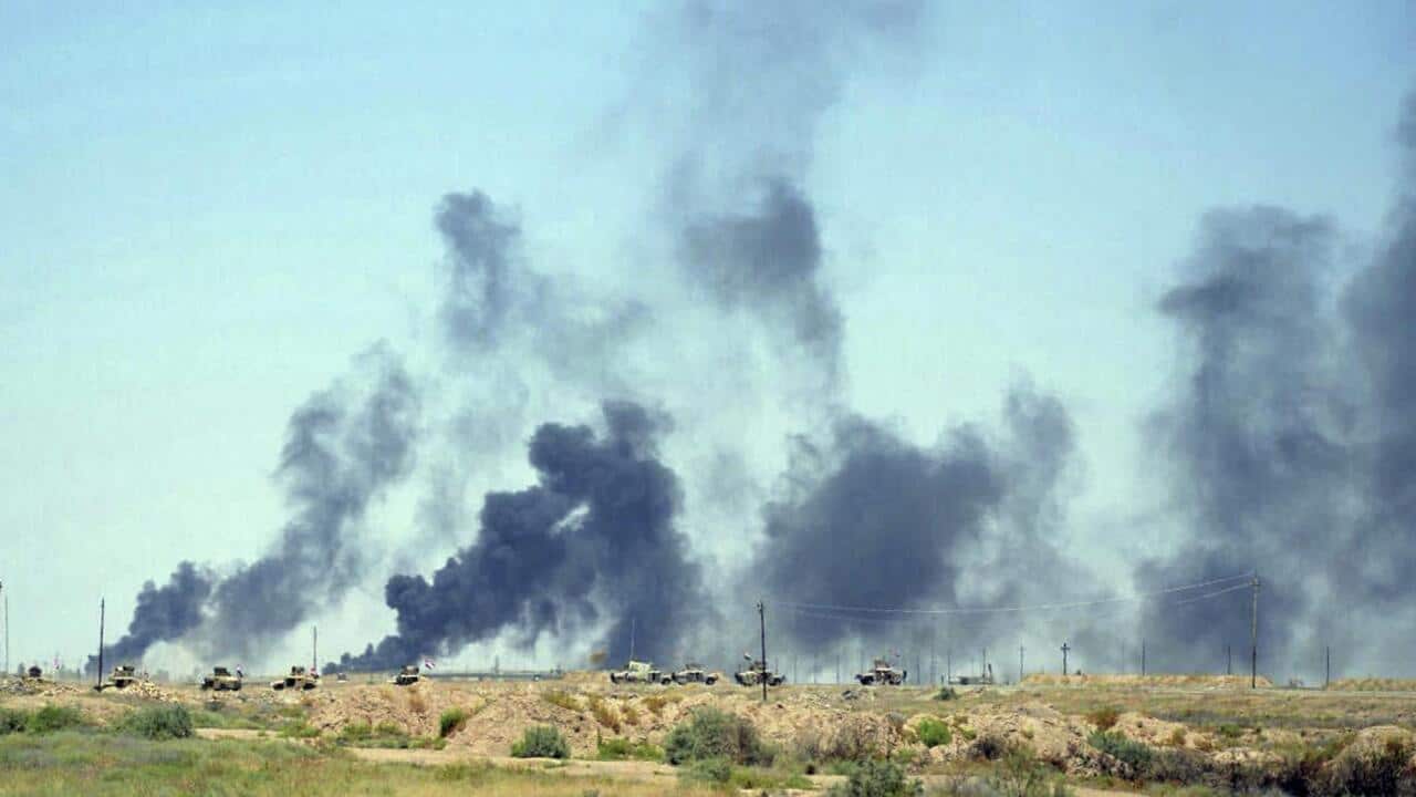 Smoke rises from US-led coalition airstrikes as Iraqi security forces advance in the southern neighbourhoods of Fallujah