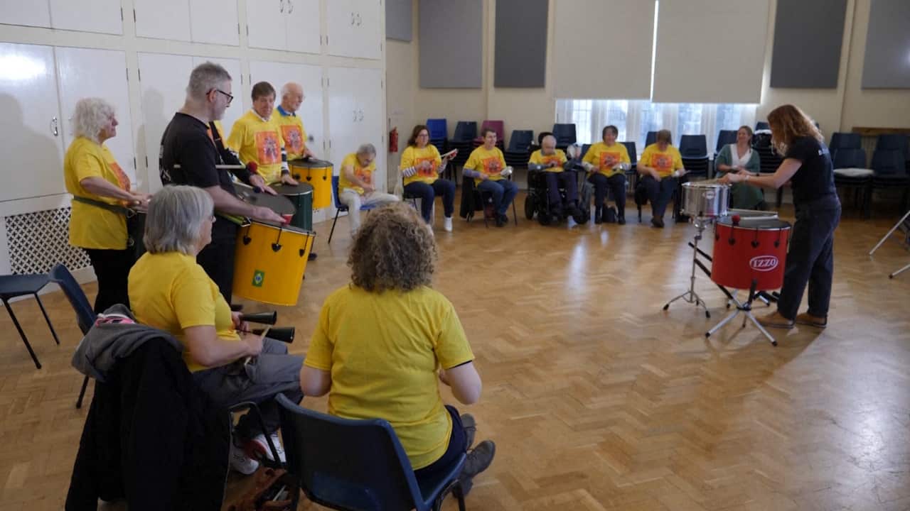 Parkinson's patients enjoying a Samba drumming class in Cardiff, Wales.
