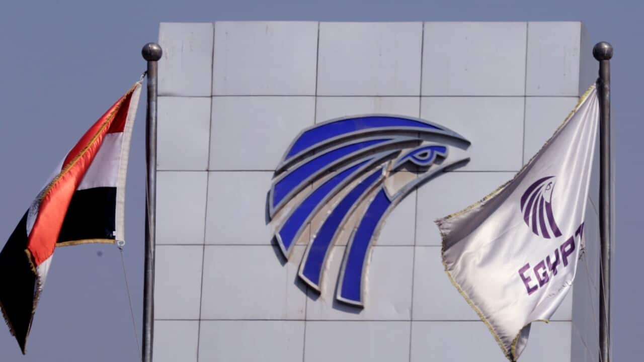 An Egypt and EgyptAir flags are seen over Egyptair in-flight service building where relatives were been being held at Cairo International Airport
