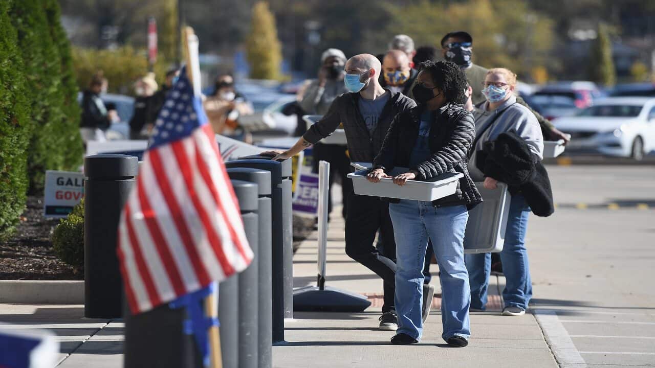 Voters line up to cast their ballots on 3 November, 2020 at the St Louis County Board of Elections in St Ann, Missouri.