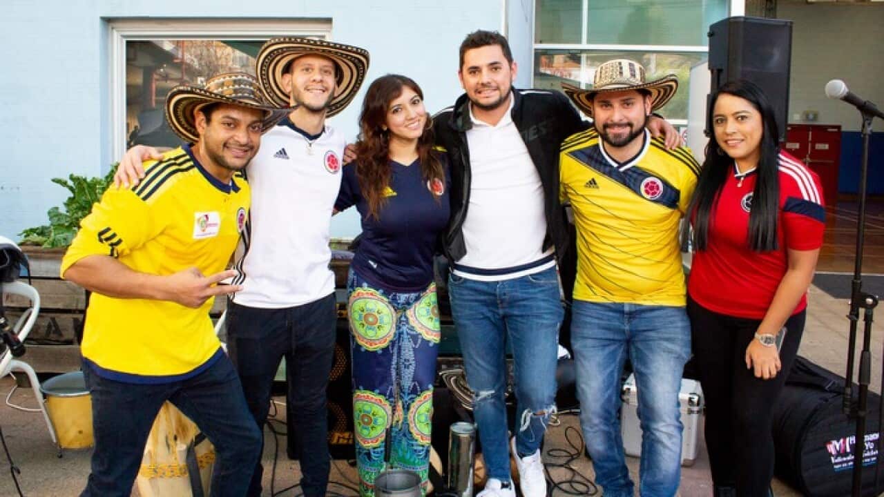 Johanna Castillo, right, with Colombian musicians including Ivan Caceres, second from right, after a football tournament in Sydney