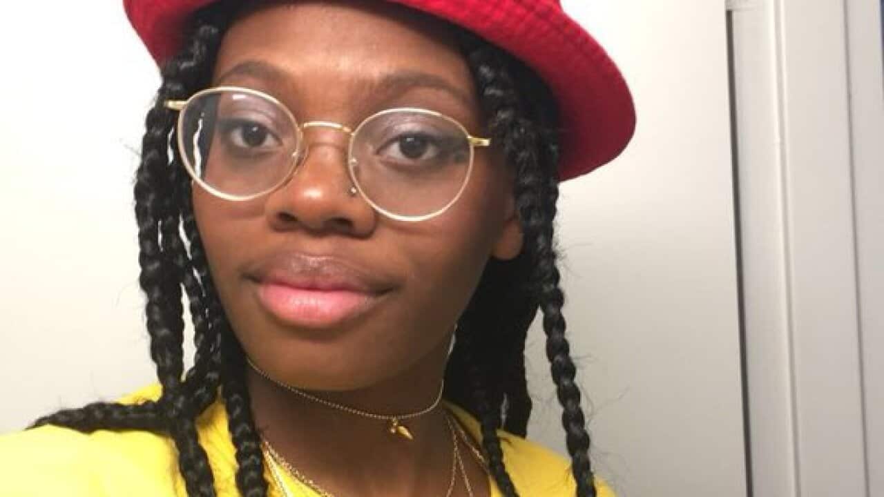 Woman in Make America Great Again hat