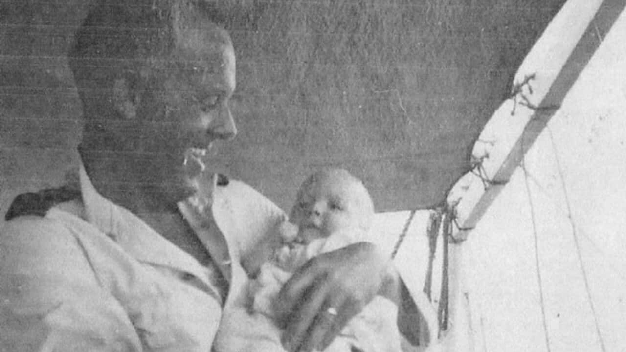 A supplied image obtained Sunday, August 19, 2019 of Frederick Francis Harmer holds his newborn son Ron, who traveled to Nauru to try and find his father's burial site. (AAP Image/Supplied) NO ARCHIVING, EDITORIAL USE ONLY