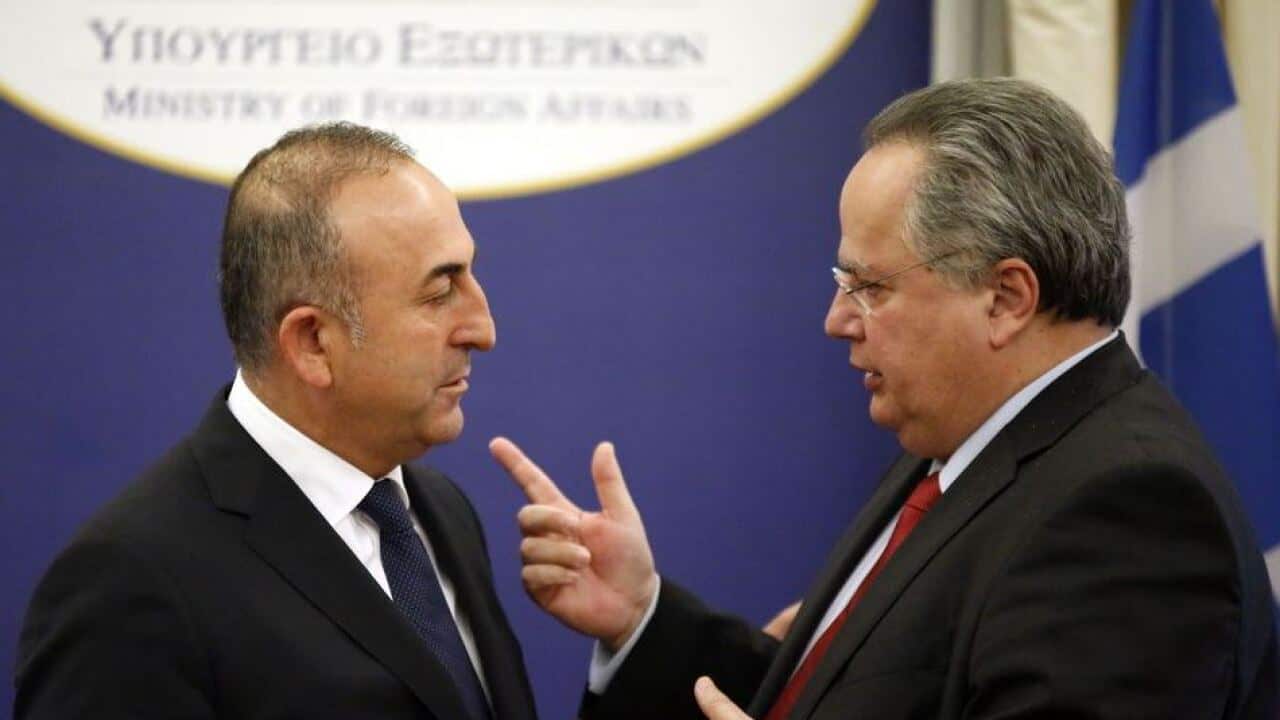 Mevlut Cavusoglu (L), Nikos Kotzias.