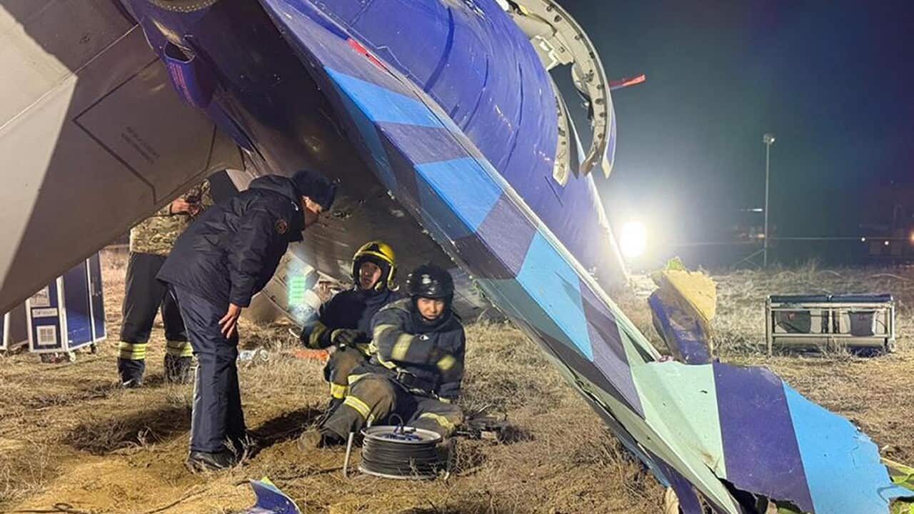 Rescuers work at the wreckage of Azerbaijan Airlines Embraer 190 (AAP)