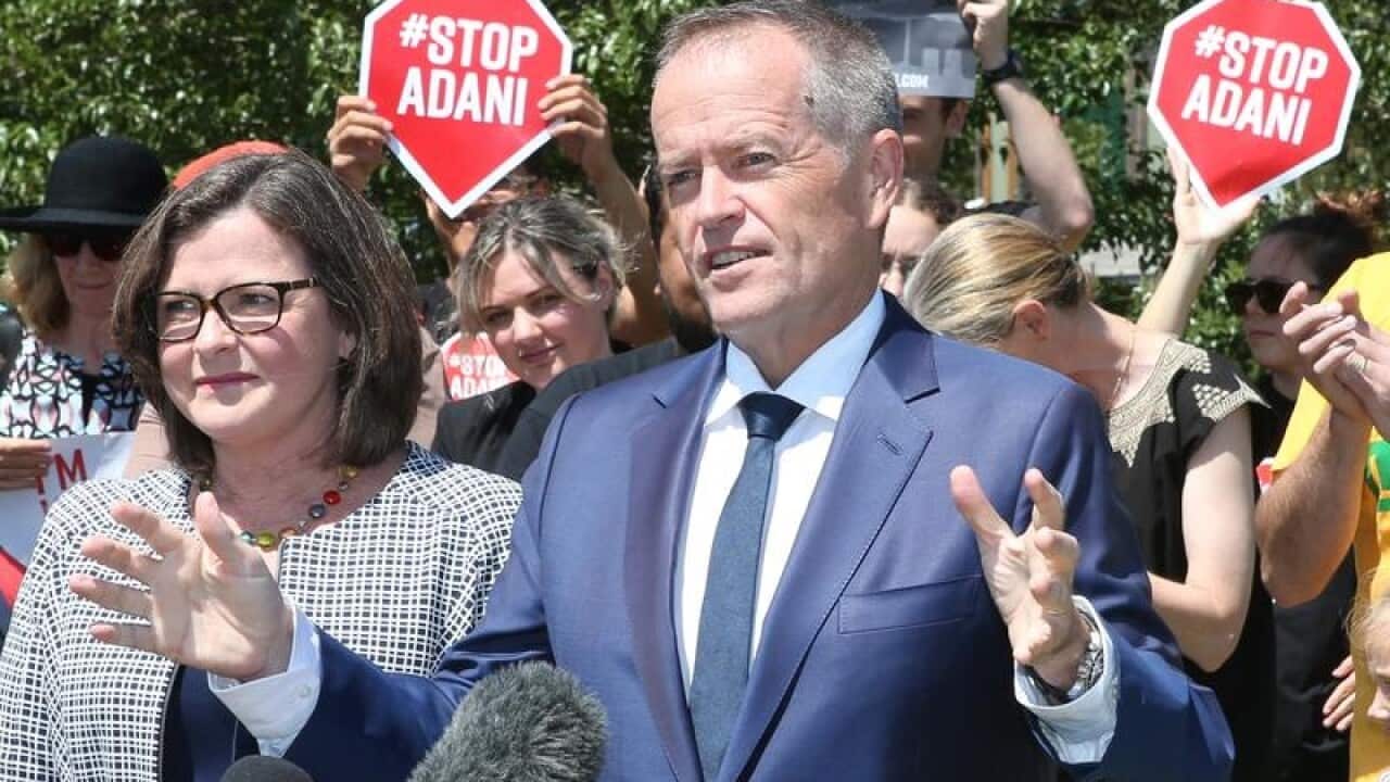 Labor leader Bill Shorten speaks in front of Adani protesters.
