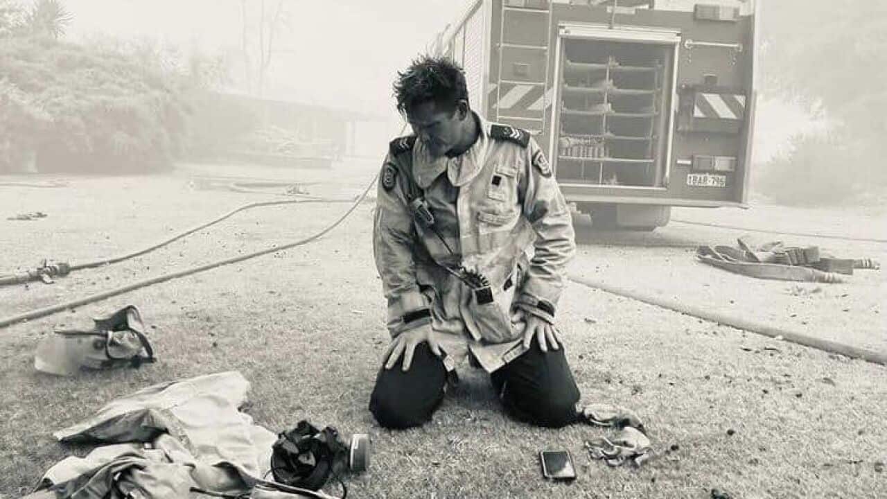 Career Firefighter Mick Dybac captured this powerful moment of fellow Daglish Senior Firefighter David Ellis, in front of a home they had just saved in the Wooroloo bushfire.