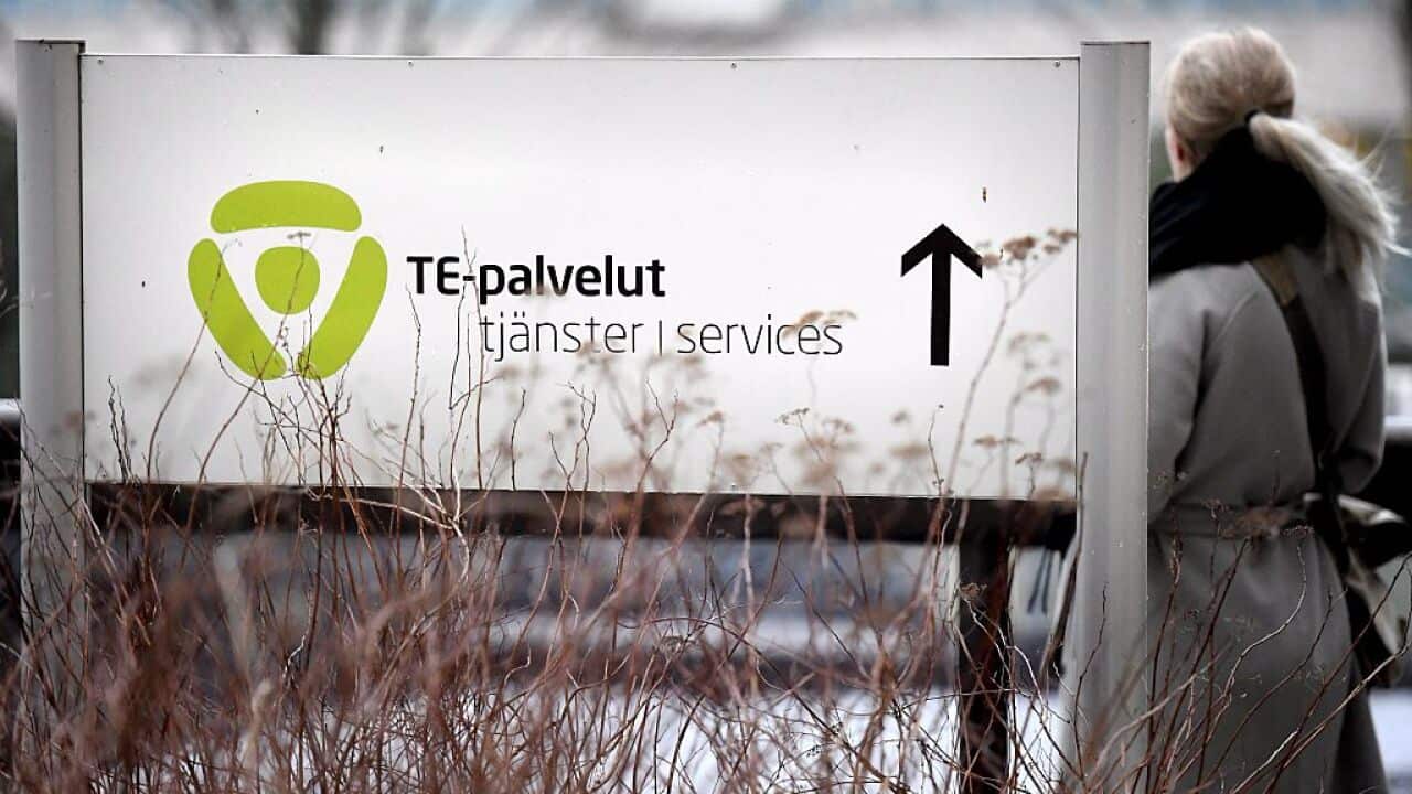 A woman entering the employment agency in Helsinki, Finland.