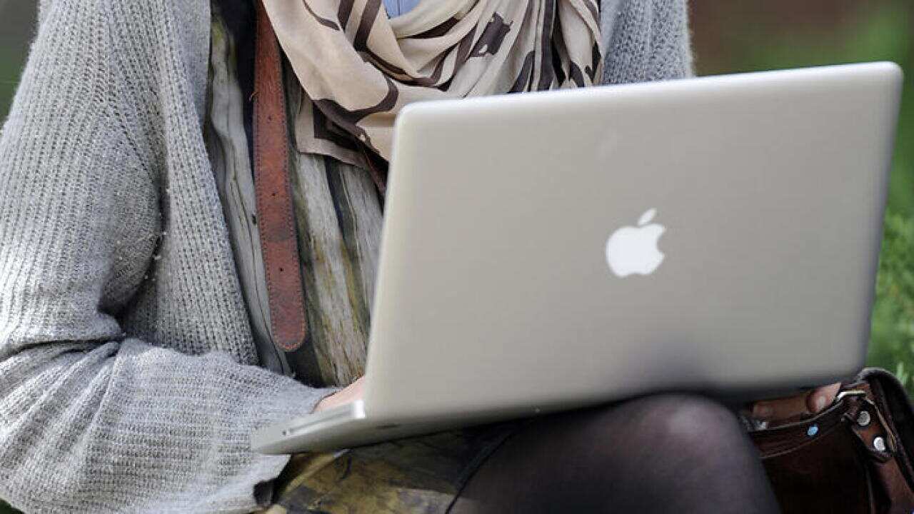 A tertiary student looks at a laptop at the University of Melbourne in Melbourne, Wednesday, May 8, 2012. (AAP Image/Julian Smith) NO ARCHIVING