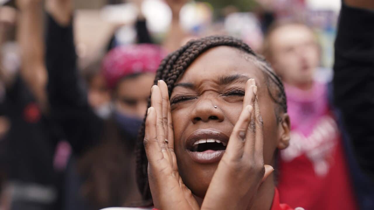 A woman speaks during a protest in Louisville, on 23 September.