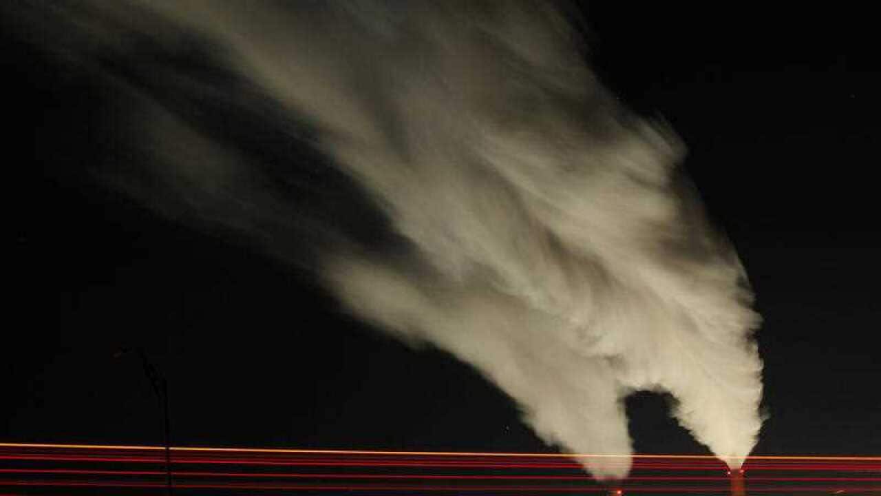Smoke rises in this time exposure image from the stacks of the La Cygne Generating Station coal-fired power plant in La Cygne, Kan.