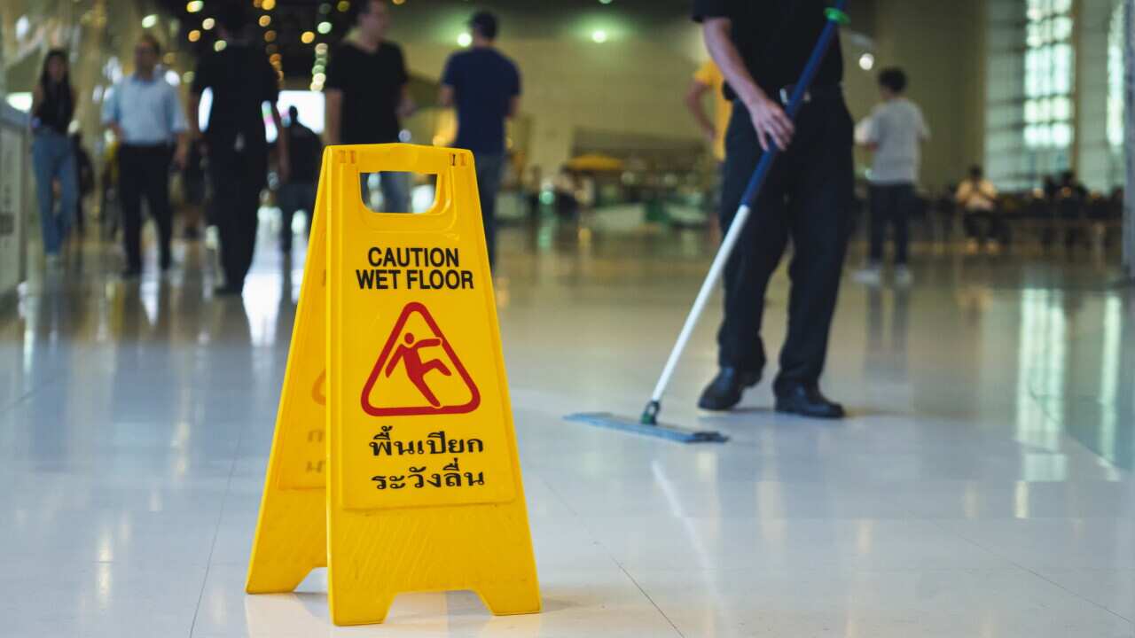Wet floor caution sign on floor