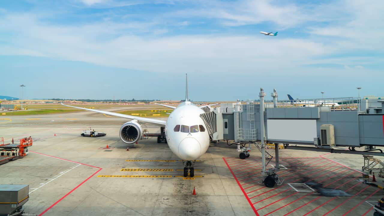 Airplane at the terminal gate ready for takeoff in modern international airport