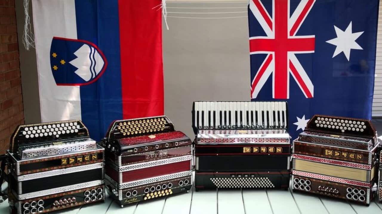 Slovenian and Australian flags with Slovenian accordions