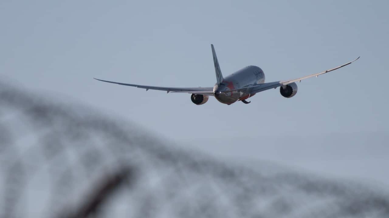 An aircraft taking off from Sydney Airport, Friday, March 20, 2020.