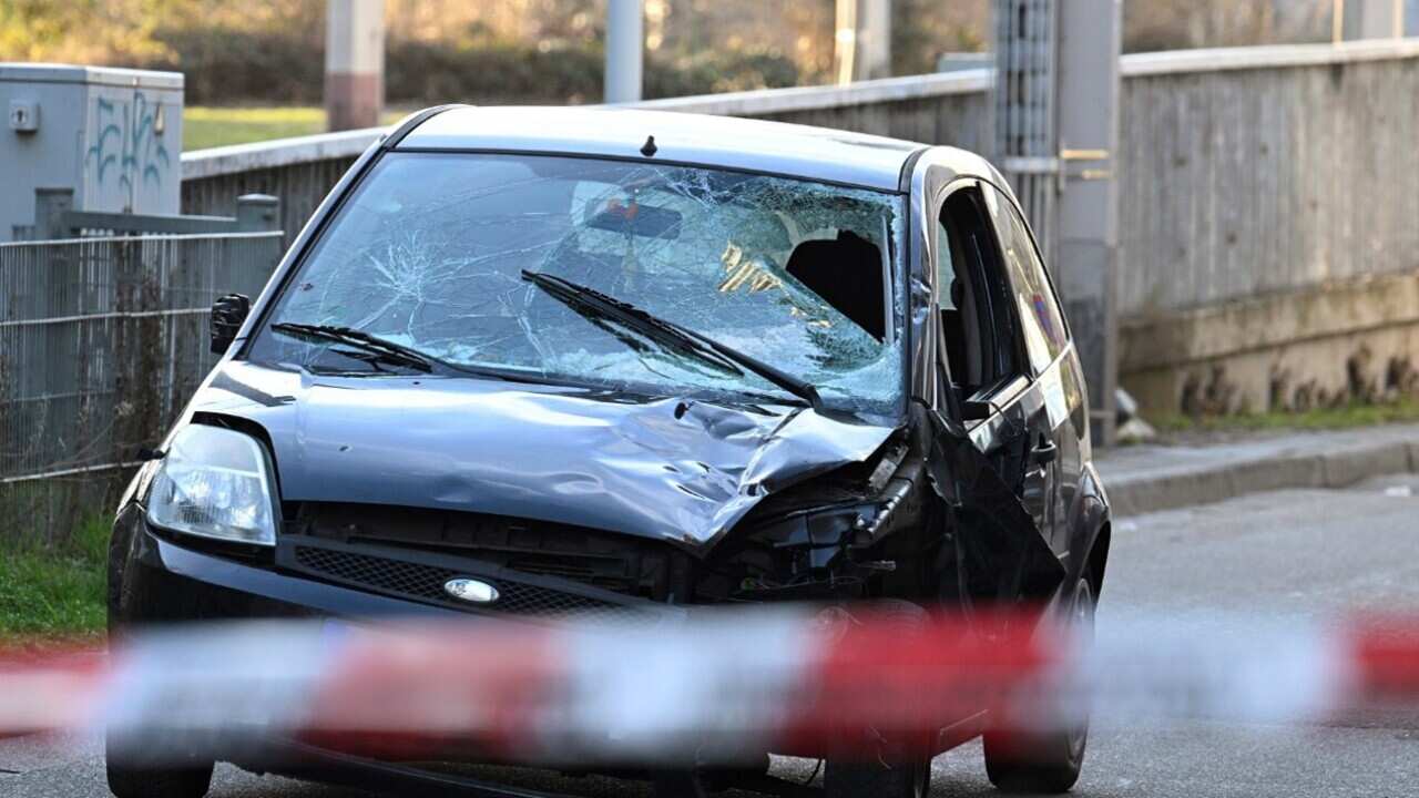 The damaged vehicle following the attack (AAP).jpg