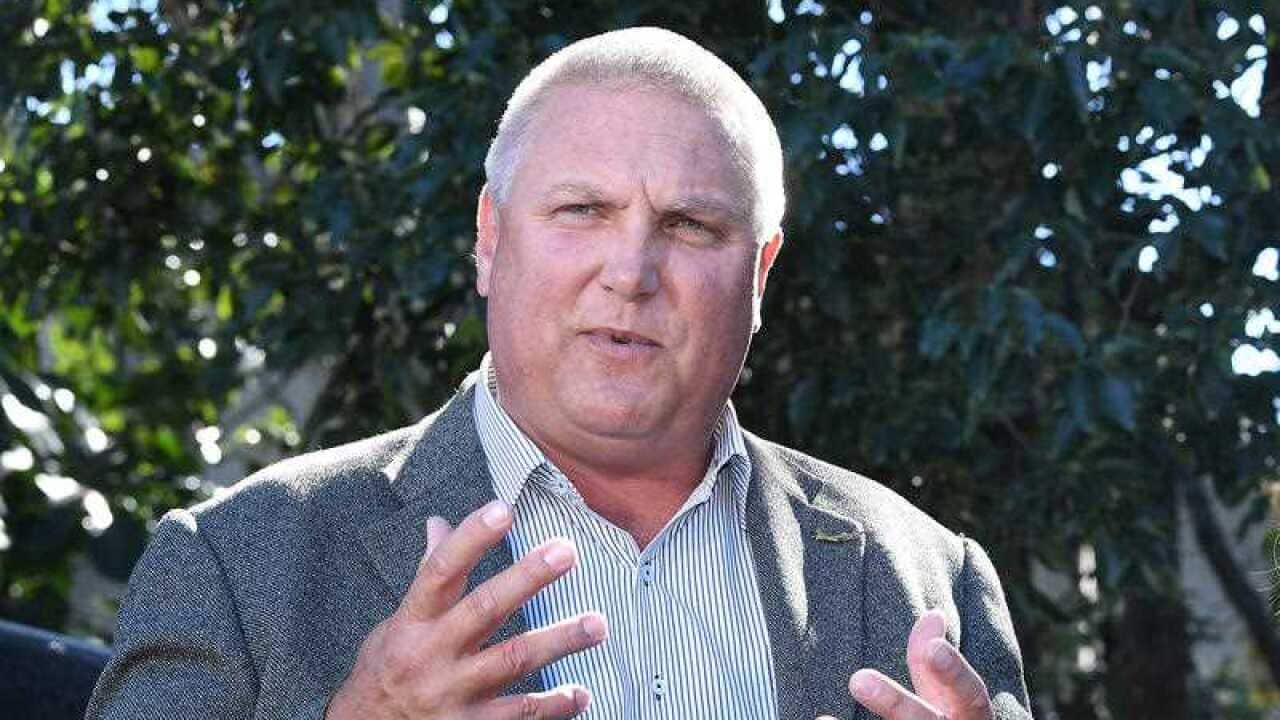 The LNP candidate for the Longman byelection is under a cloud after his credibility was questioned.