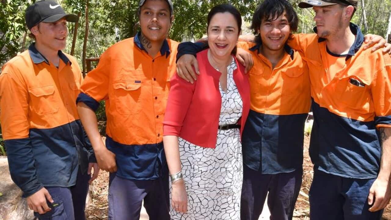 Queensland Premier Annastacia Palaszczuk (C) with young trainees