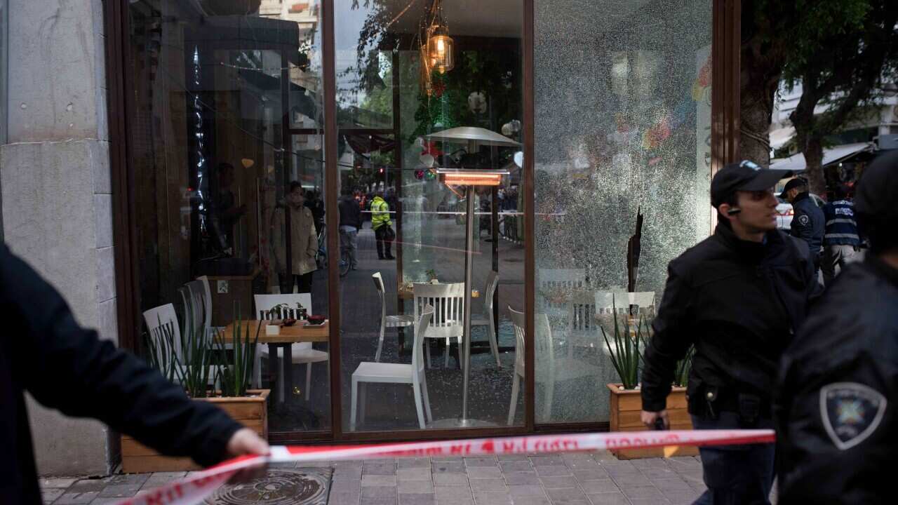 Israeli police at the scene of a shooting attack in a bar in central Tel Aviv, Israel