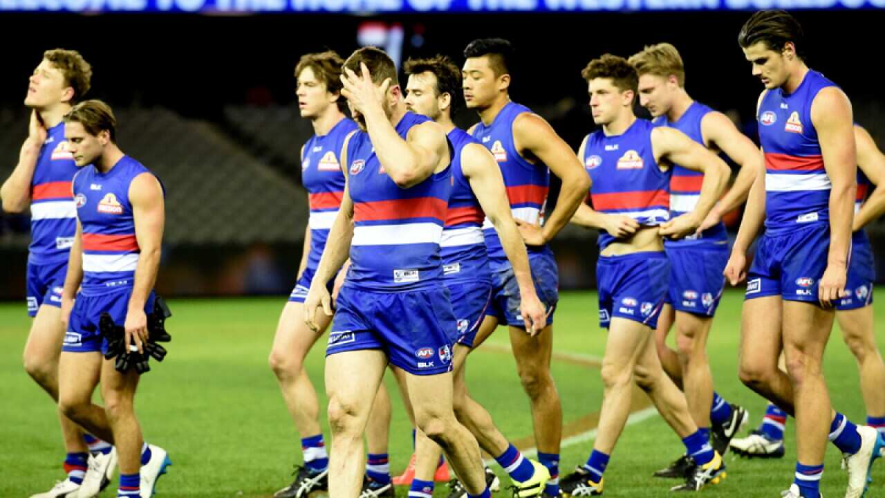 Bulldogs players walk off the field