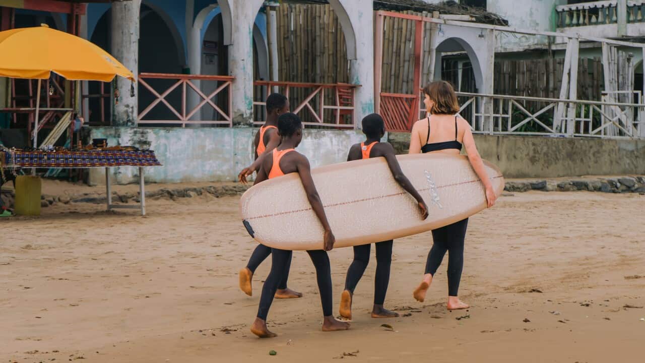 Surfer Lucy Small with Ghanaian surfer girls (Supplied- Maddie Mennings).jpg