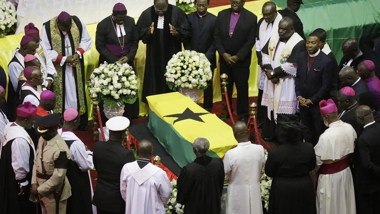 Clergymen pray over the coffin of Kofi Annan.