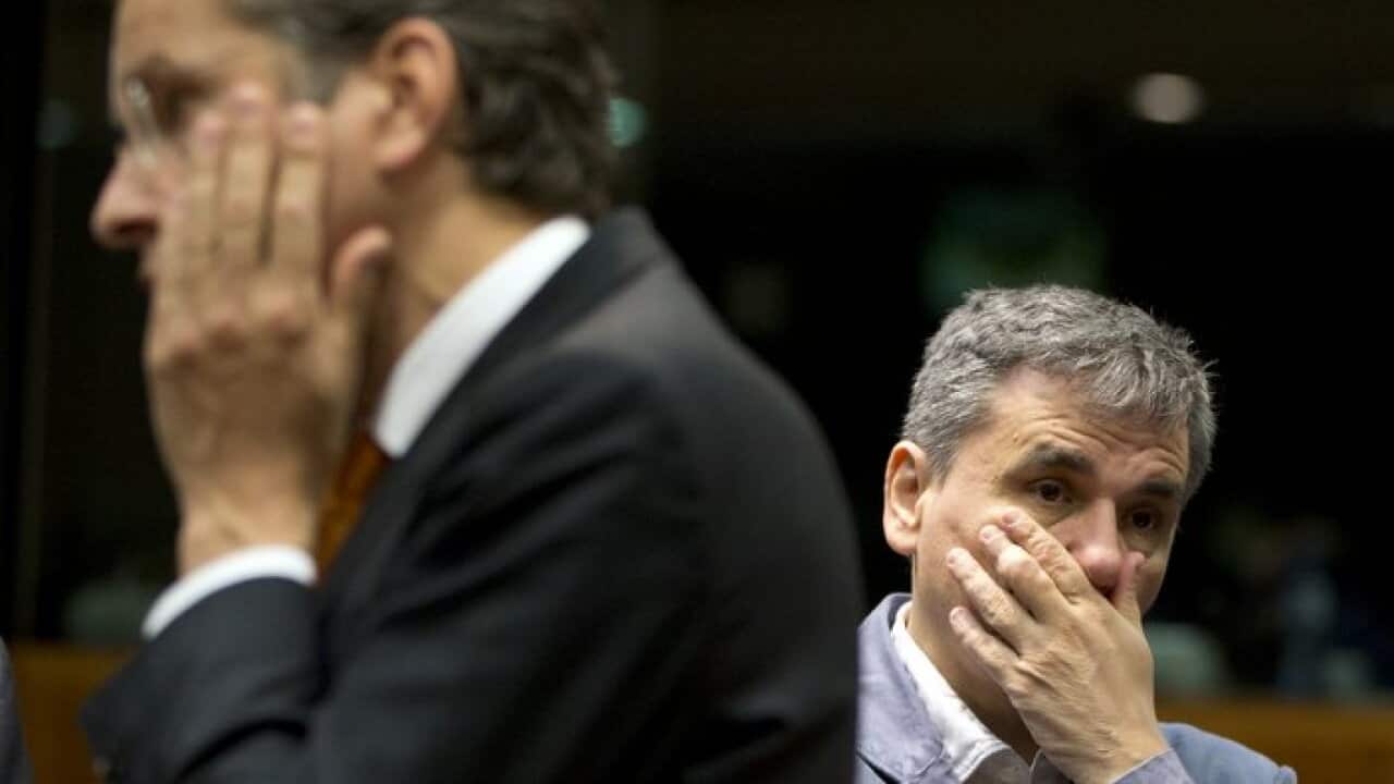 Greece's Finance Minister Eucleidis Tsakalotos, right, and Dutch Finance Minister and Eurogroup President, Jeroen Dijsselbloem