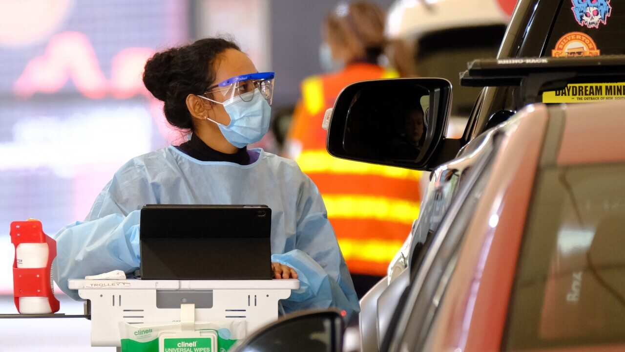 Health workers testing people for COVID-19 at the Royal Melbourne Showgrounds on Monday, 24 May, 2021.