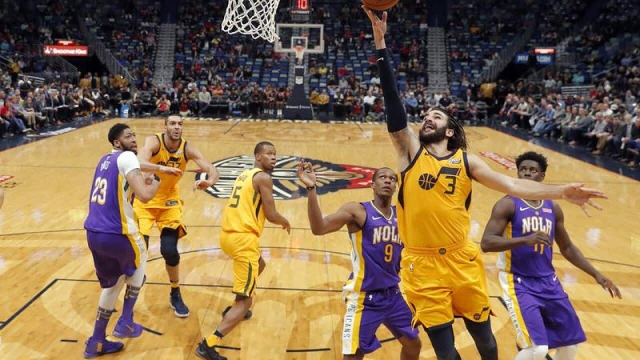 Utah Jazz guard Ricky Rubio (3) drives to the basket.