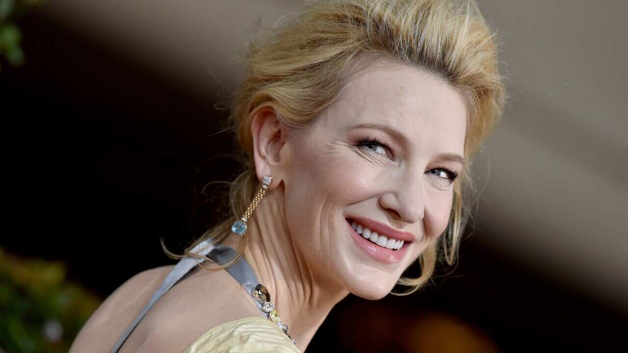 Cate Blanchett looking back over her shoulder while attending a previous awards ceremony.