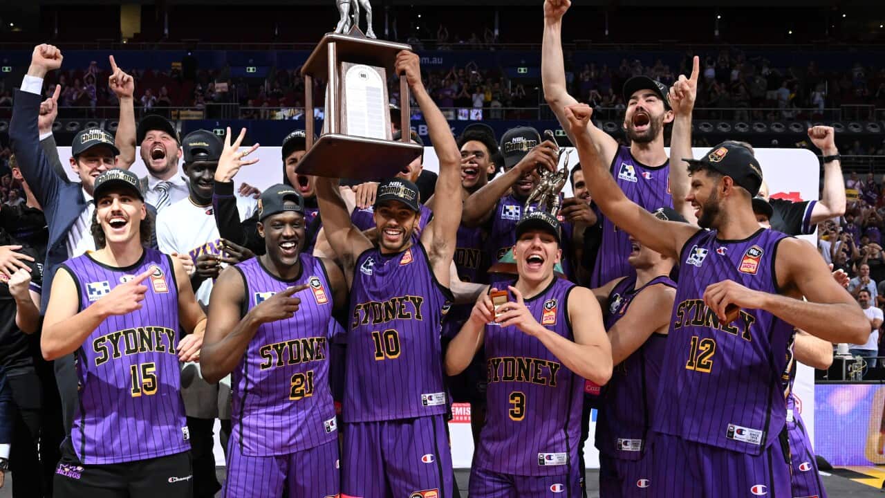 Sydney Kings celebrate after winning in the NBL Grand Final Game 5 against New Zealand Breakers