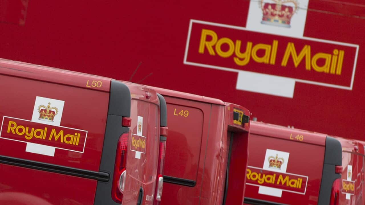 Royal Mail vans line up at a London sorting office