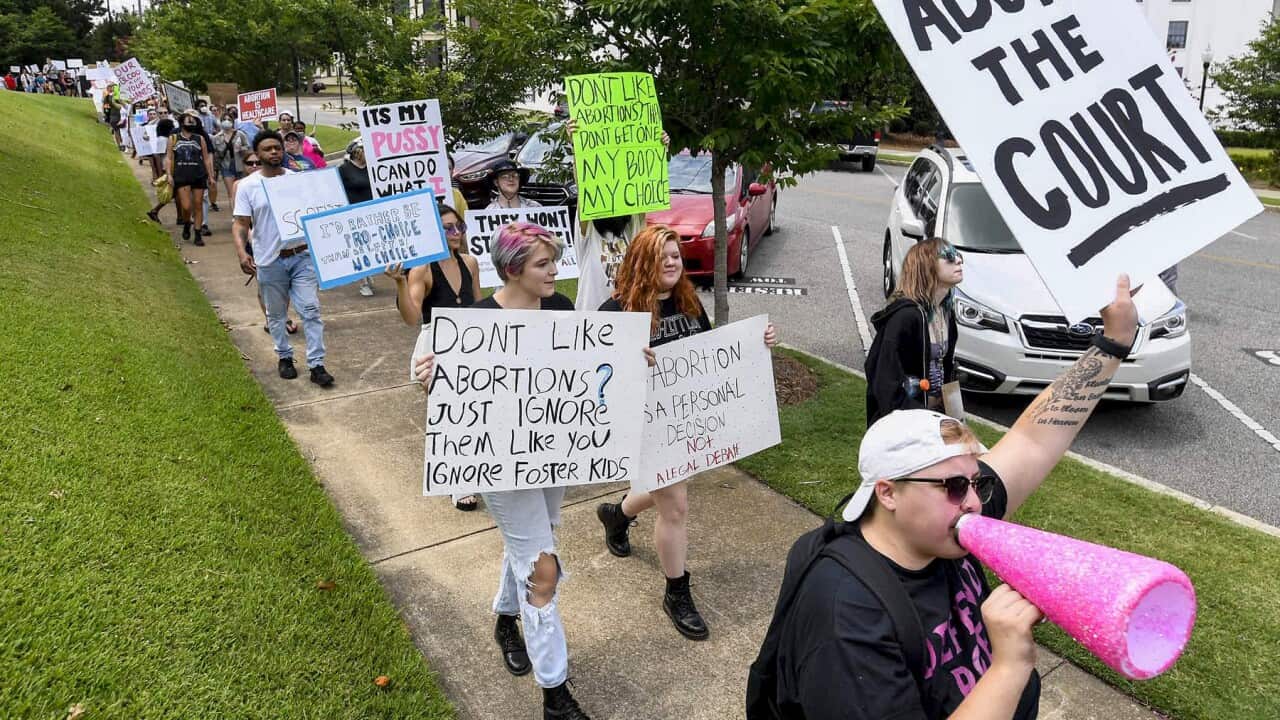 Abortion rights protestors march on to Alabama state capitol building in Montgomery