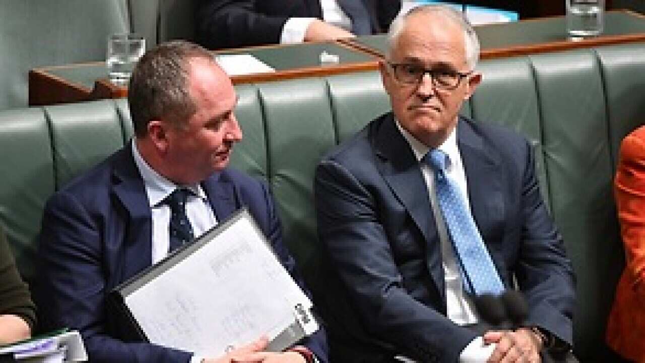 Deputy Prime Minister Barnaby Joyce and Prime Minister Malcolm Turnbull during Question Time in the House of Representatives in Canberra, Wednesday, October 25, 2017. (AAP Image/Mick Tsikas) NO ARCHIVING