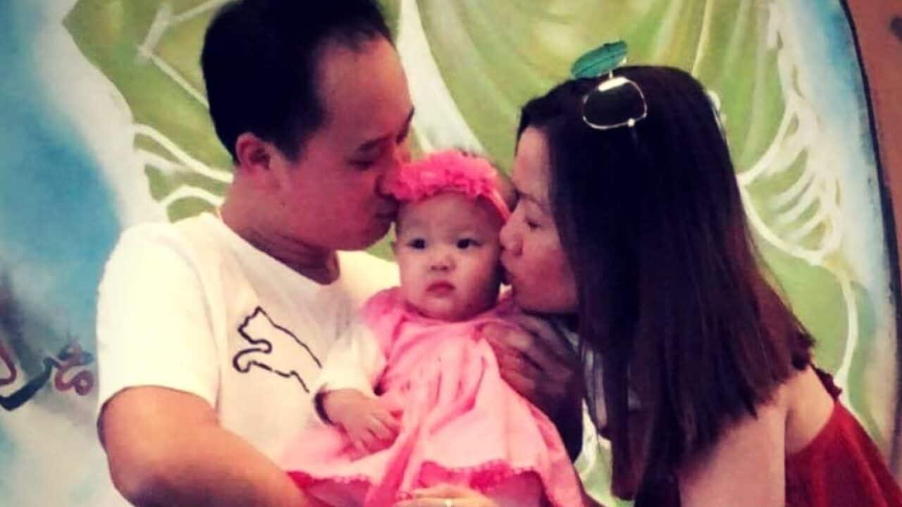 Huyen Thu Thi Tran (right) kisses Isabella Lee Pin Loong.